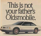 Old-fashioned sepia ad with picture of car and slogan 'this is not your father's Oldsmobile'