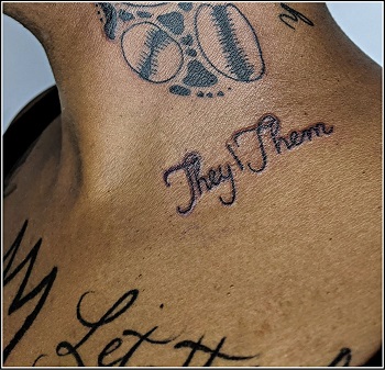 Picture of a individuals neck with a tattoo of They Them