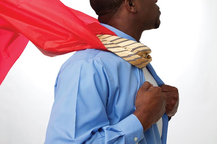 Black man wearing a red cape