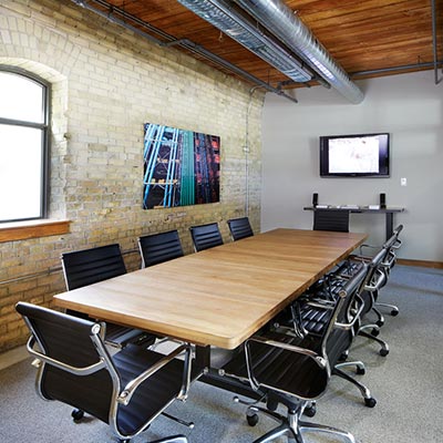 Boardroom beside a brick wall