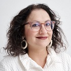 headshot photo of co-author Ena Chadha