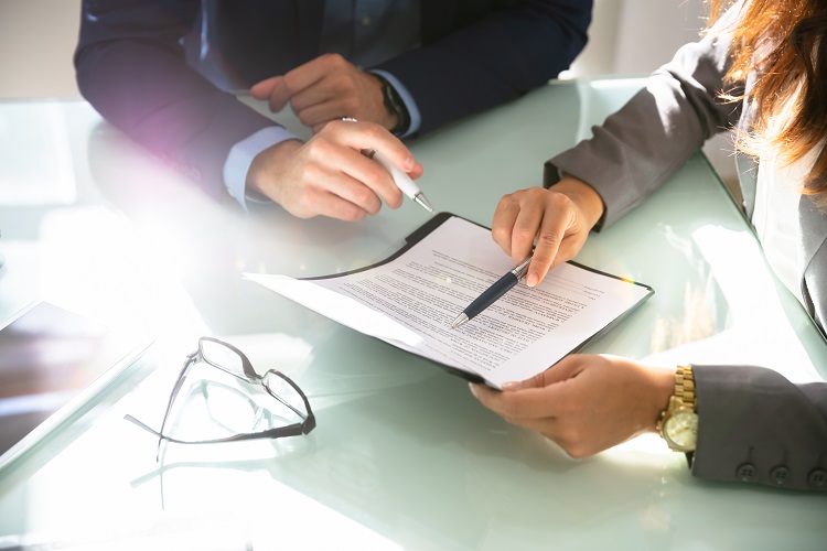 Man and woman reviewing legistlative document