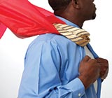 Black man wearing a red cape