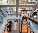 Down angle view of office with open space and stair cases