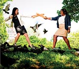 two women dueling with breadsticks