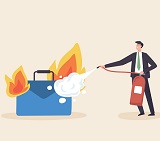 Image of man in suit using fire extinguisher to put out fire consuming briefcase, representing fighting burnout