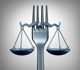 scales of justice balanced on a food fork