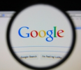 Google Logo under a magnifier lens