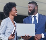 Woman and Man sharing a laptop