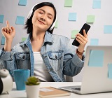 woman listening to music while working from home