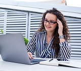 Woman looking at her laptop