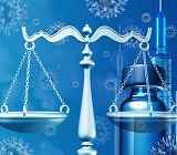 Scales of justice in front of a vaccine syringe and vial