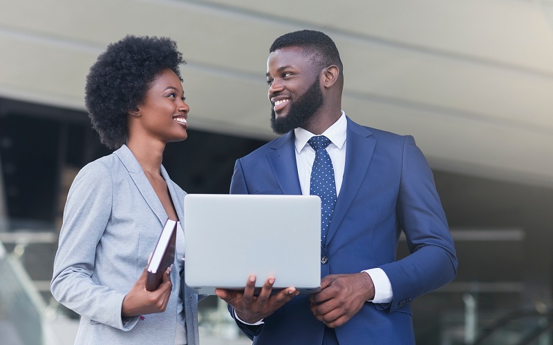 Woman and Man sharing a laptop