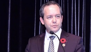 Lawyer wearing a red poppy