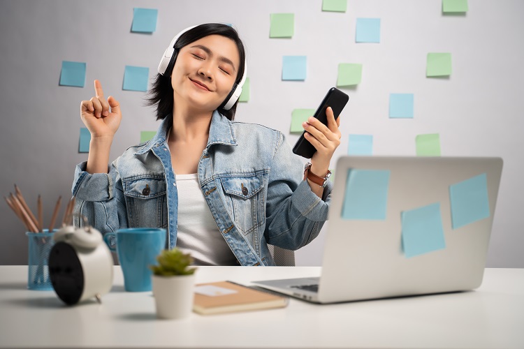 woman listening to music while working from home