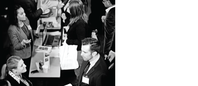 Group of people at a conference having a conversation