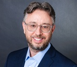 head-shot photo of author Mitchell Rose