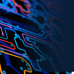 Colourful circuitboard that fades into blue background.